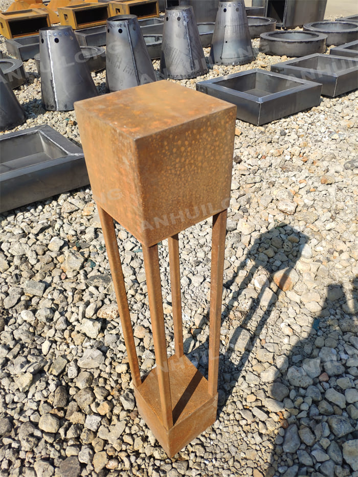 A Neatly Shaped Corten Steel Lighting That Can Stand