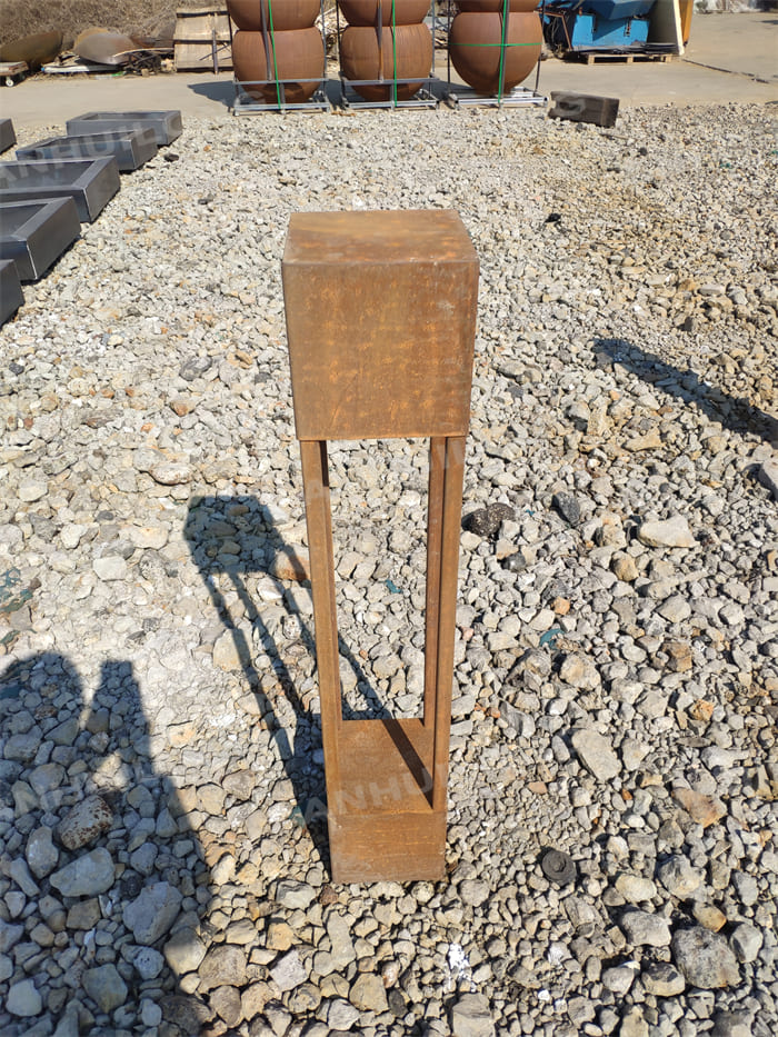 A Neatly Shaped Corten Steel Lighting That Can Stand
