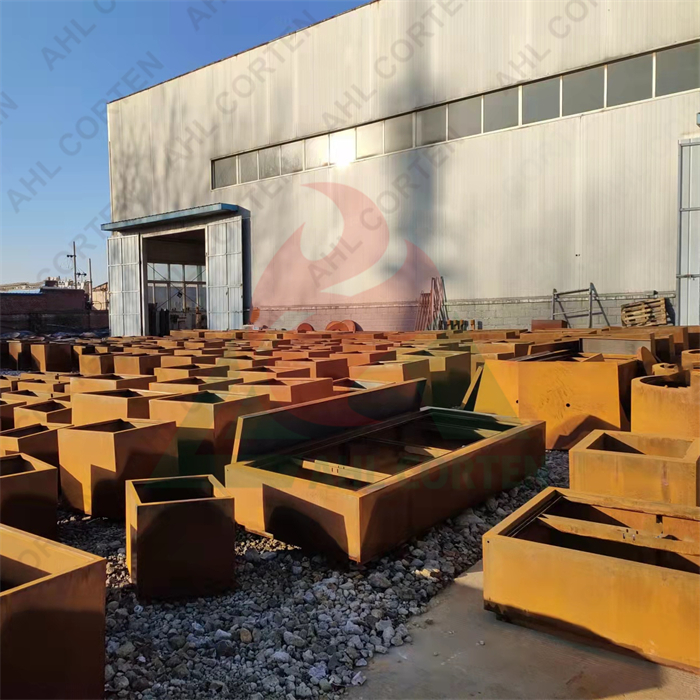 Corten steel flower pot in the garden