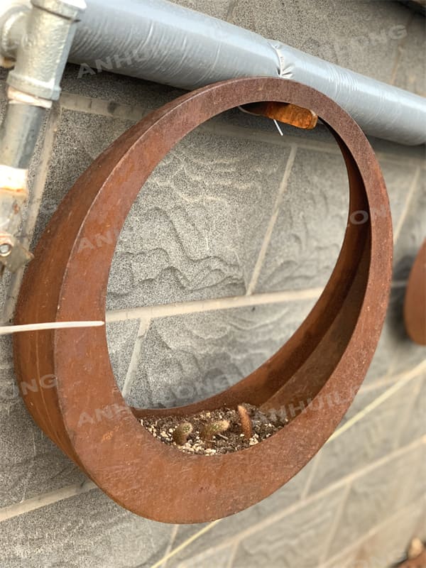 Moon like rusty metal hanging flower pots for gardening articles