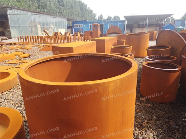 modern rusty-like cylinder palnters for landscaping