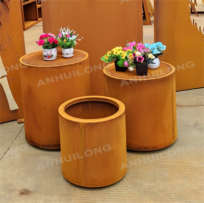 Rusty weatherproof steel flower basin at the entrance