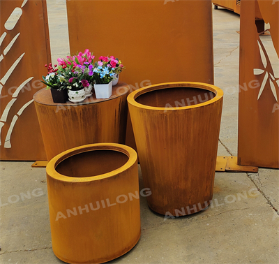 Rusty weatherproof steel flower basin at the entrance