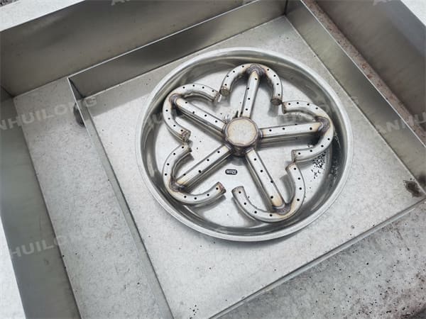 Eye-catching stainless steel fire pit with water feature