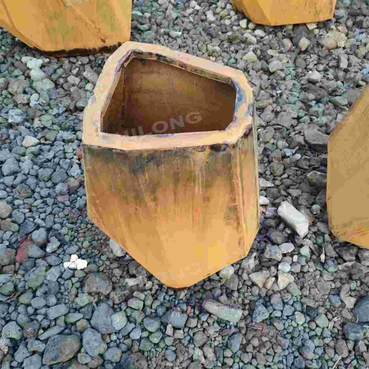 Industrial style corten steel planter for holiday village